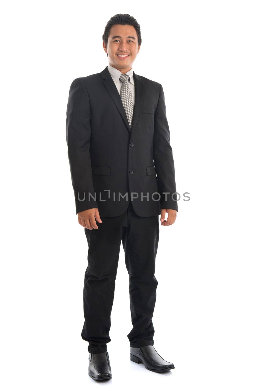 Full body attractive young Southeast Asian businessman standing isolated on white background. Asian malay male model.
