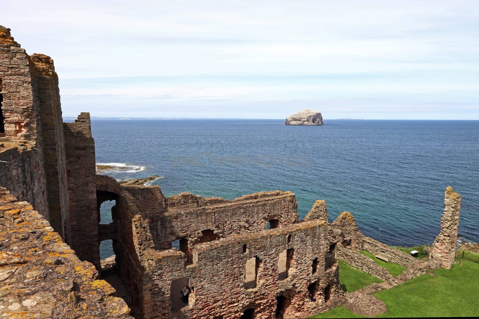 The castle ruins of Tantallon Castle with the island of Bass Rock in Scotland