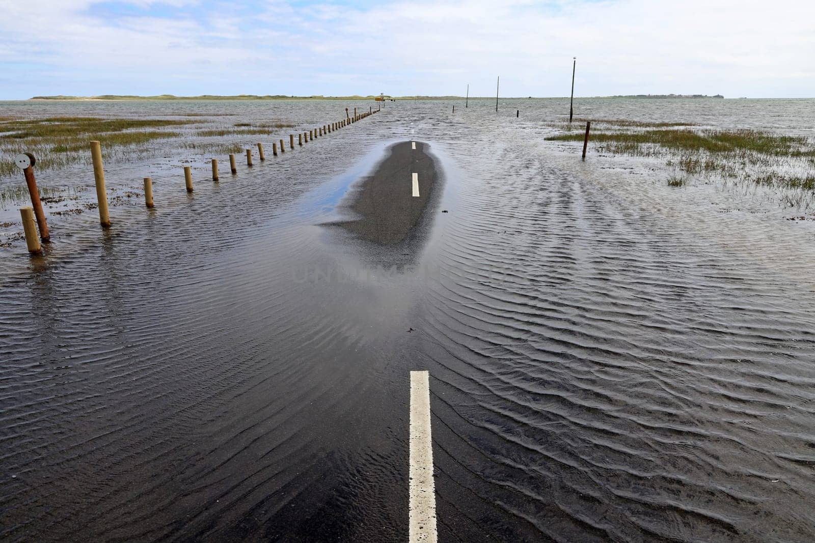 Flooding has flooded a road. Flooding on a road