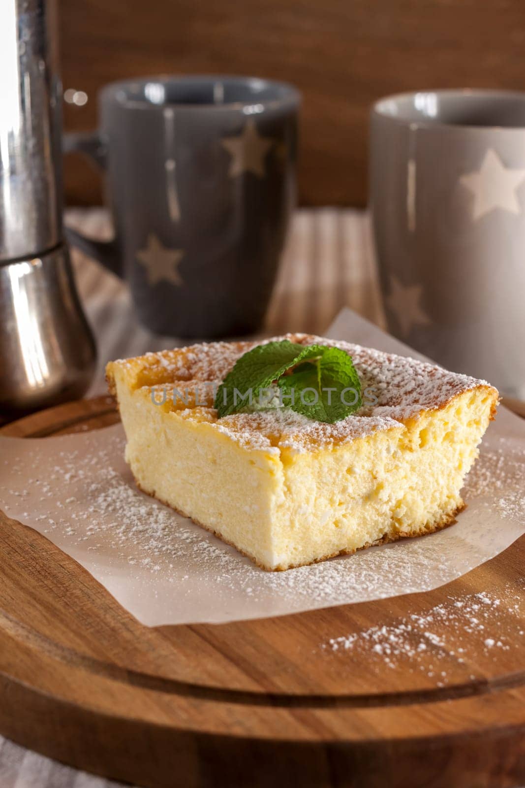 appetizing cottage cheese casserole piece and two cups