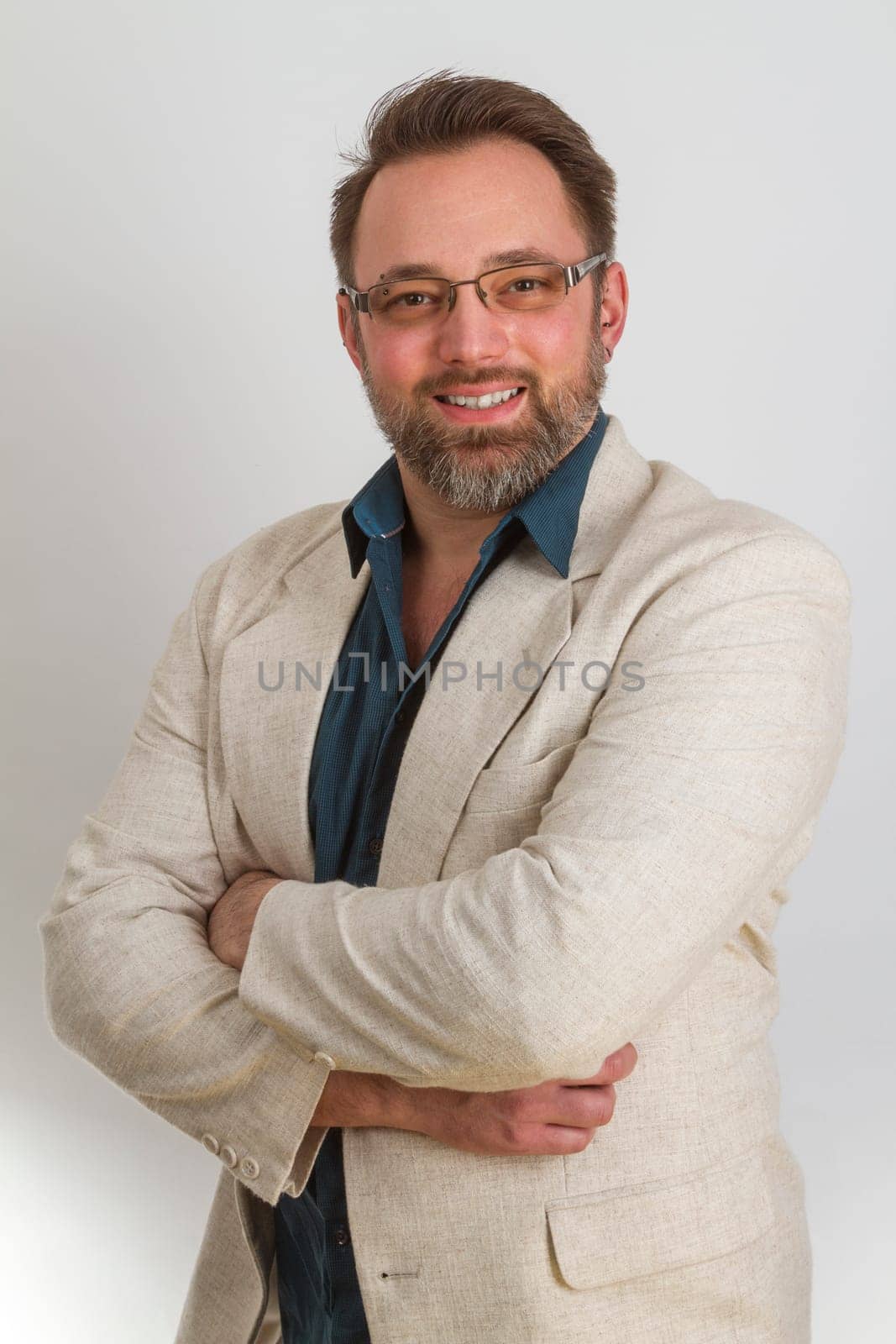 Attractive man standing on a bright background