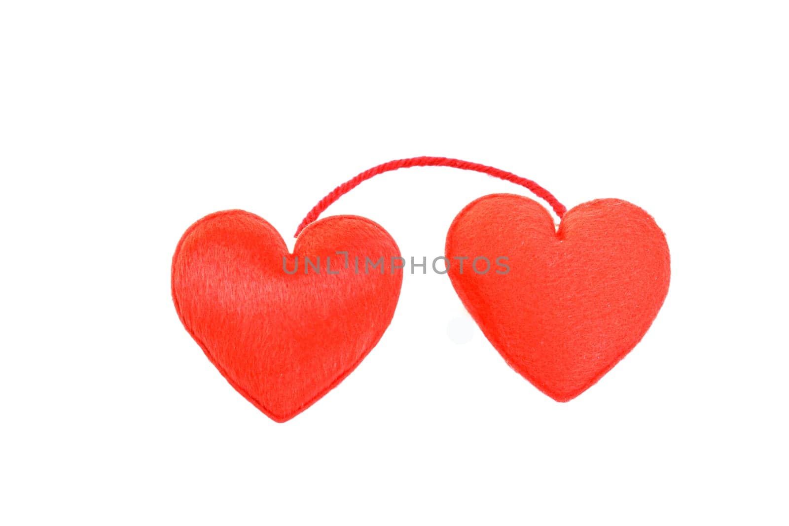 Two red hearts in love on white background