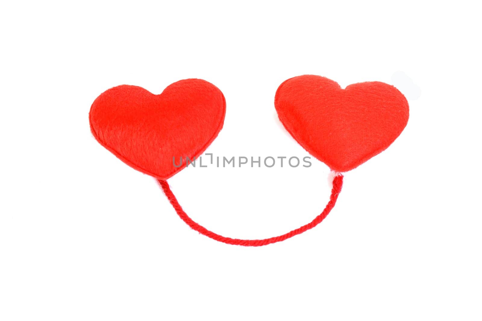 Two red hearts in love on white background