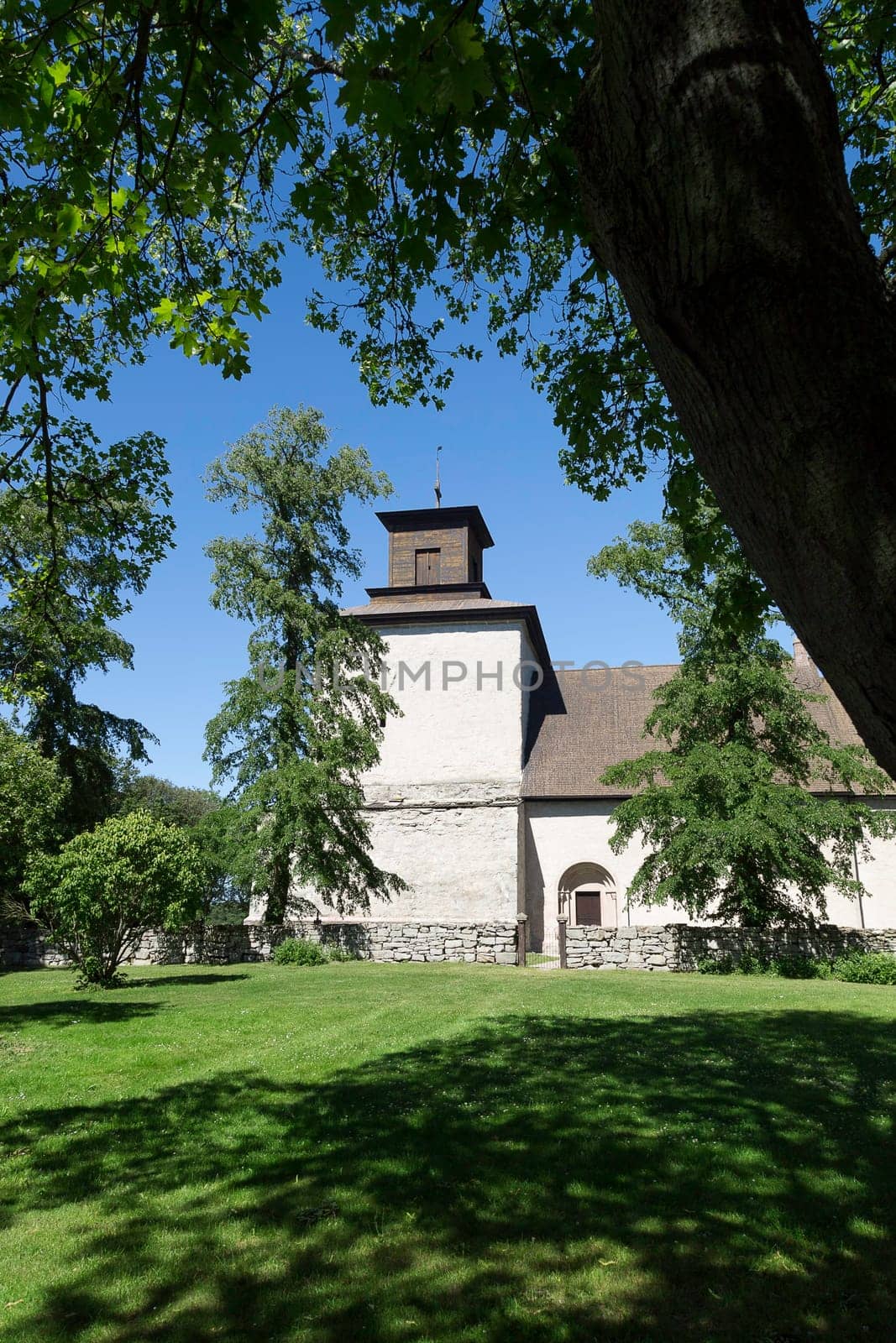 The Church in Vamlingbo, Gotland, Sweden with a clear blue sky.
