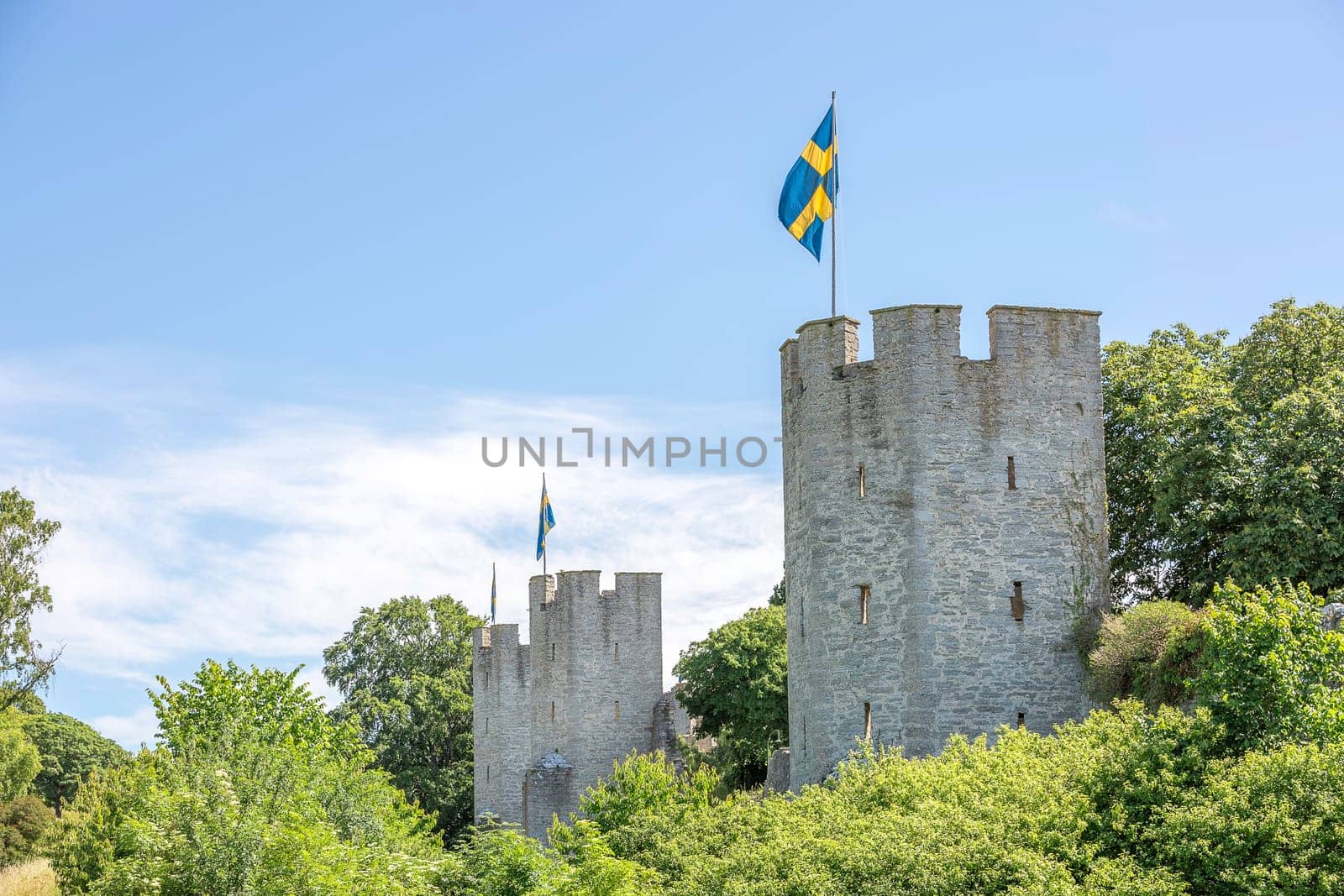 Town Wall in Visby, Gotland with the Swedish flags.