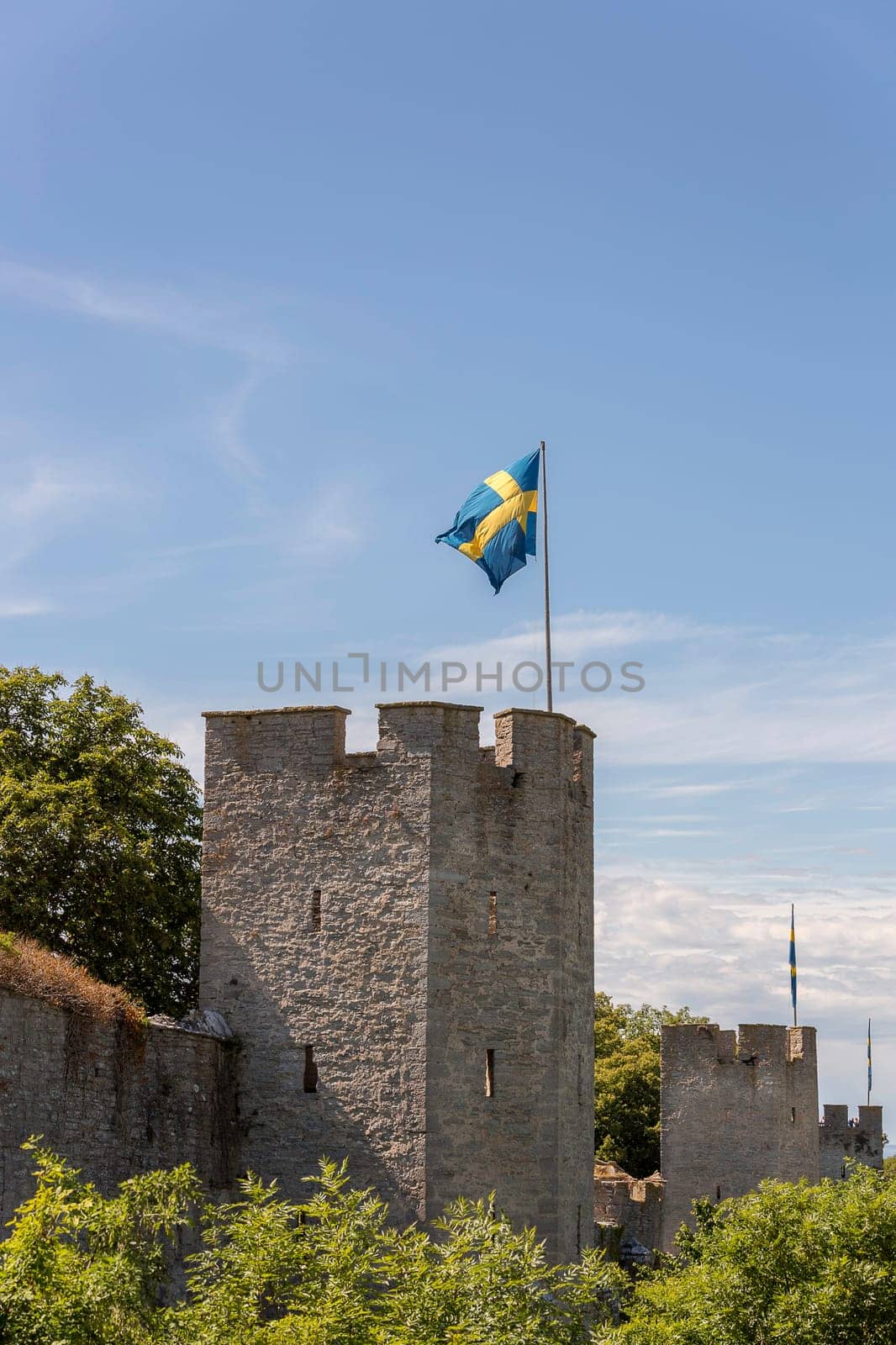 Town Wall in Visby, Gotland with the Swedish flags.