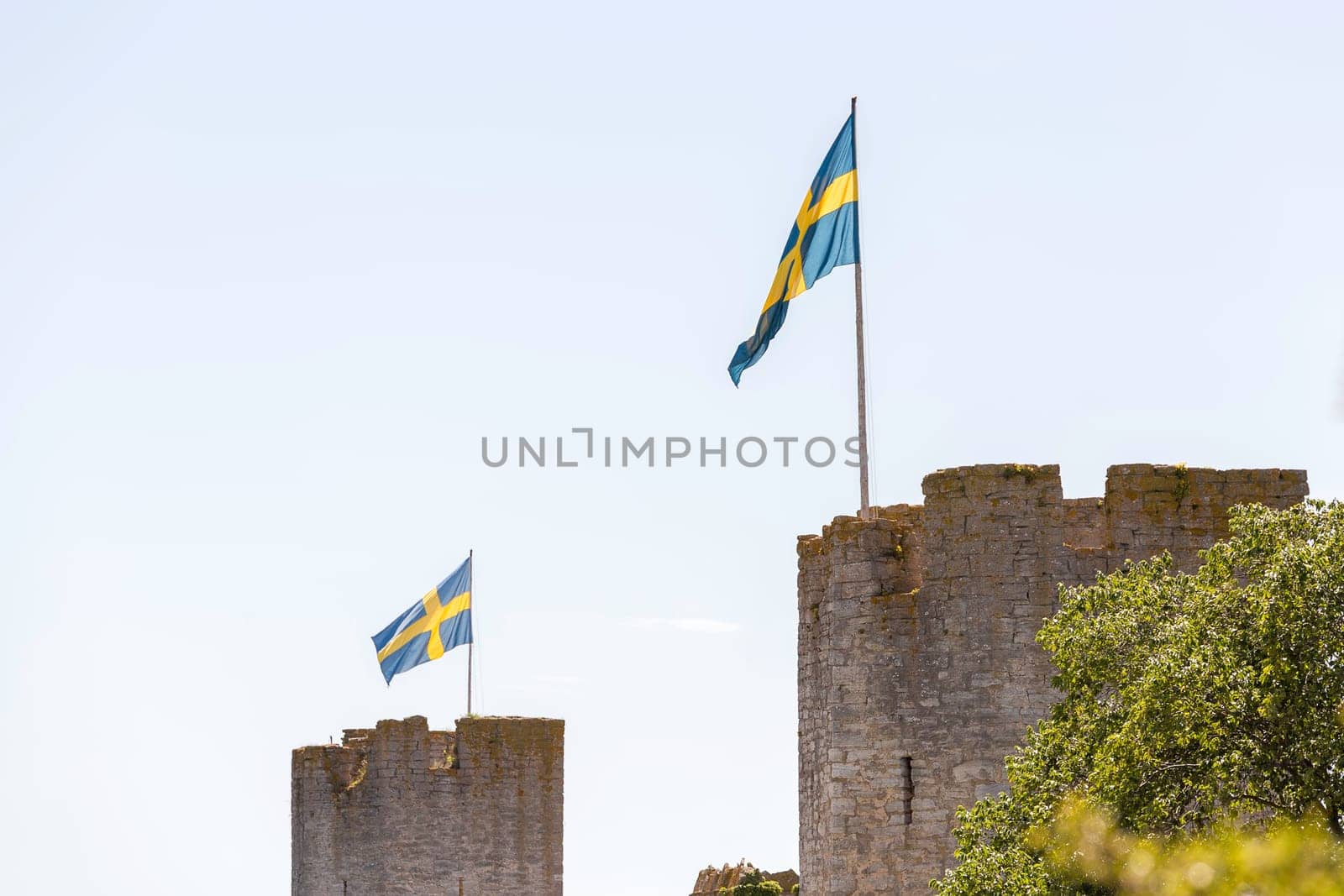 Town Wall in Visby, Gotland with the Swedish flags.