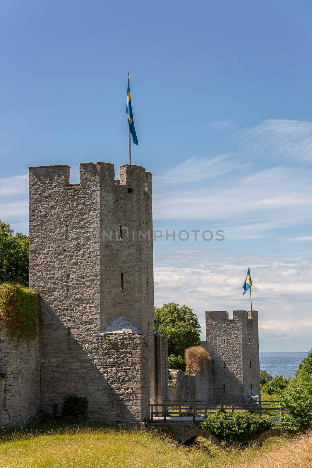 Town Wall in Visby, Gotland with the Swedish flags.