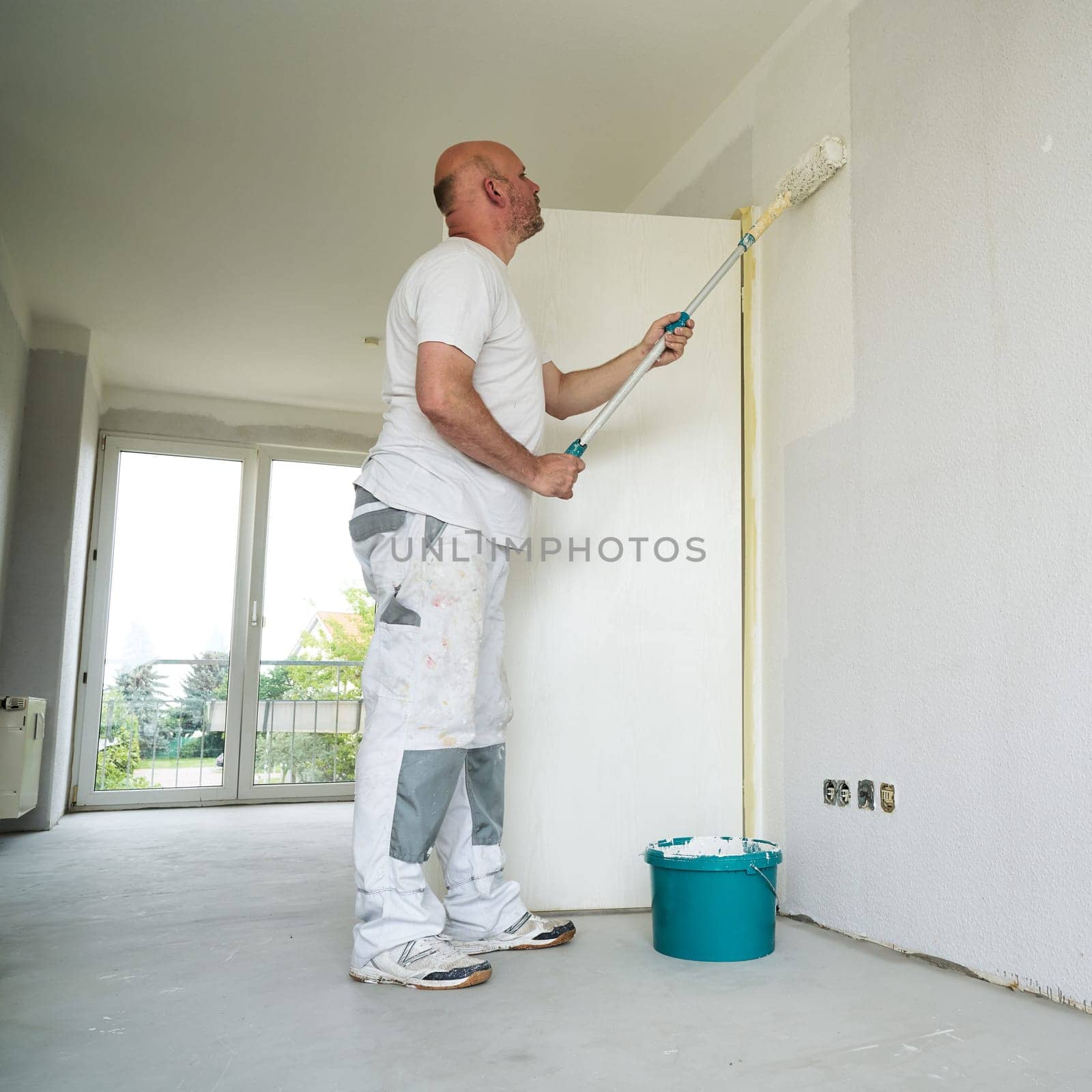 Painter during the renovation of an apartment