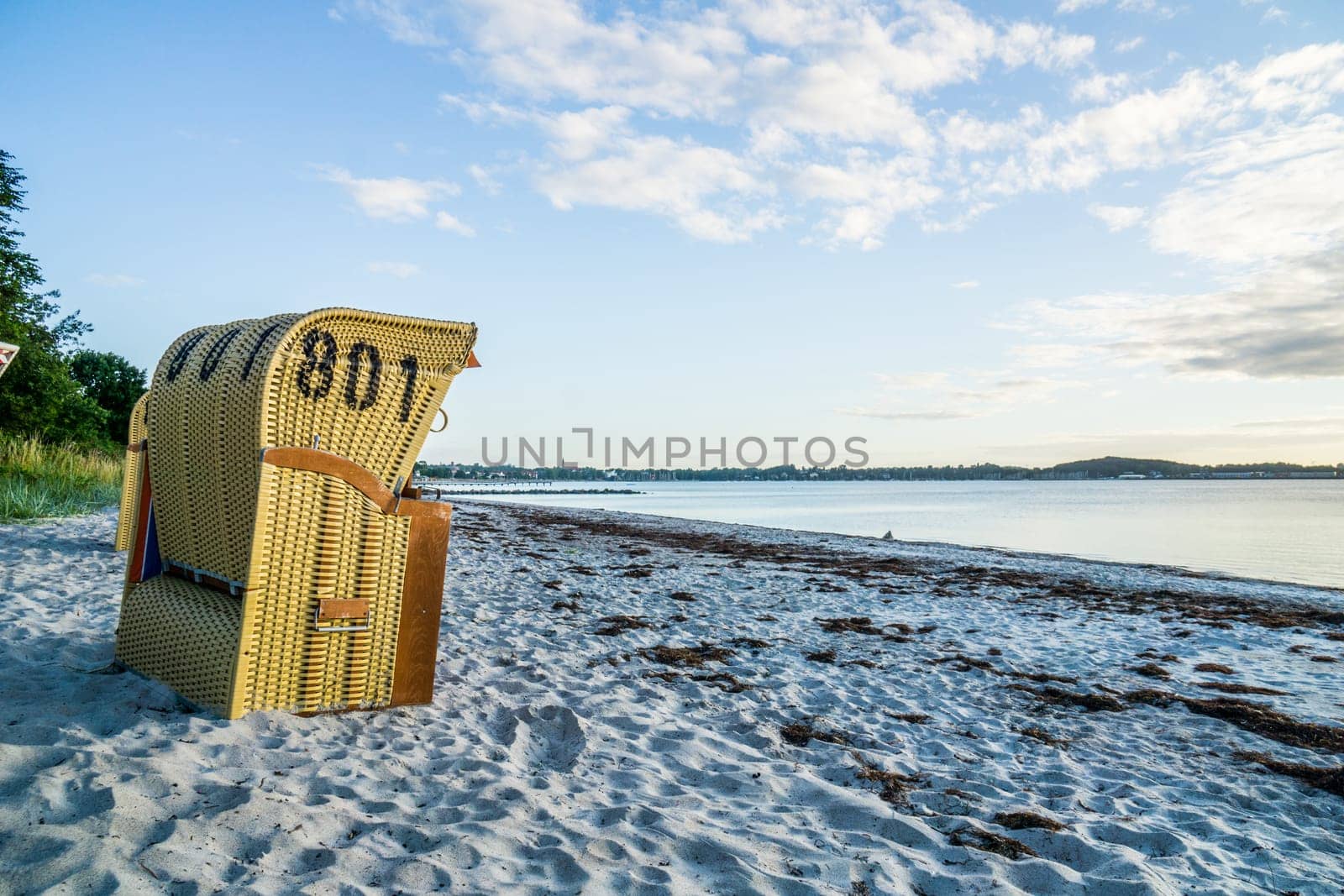 European Beach wicker chairs are placed decoratively on the beach for summer guests in the sun