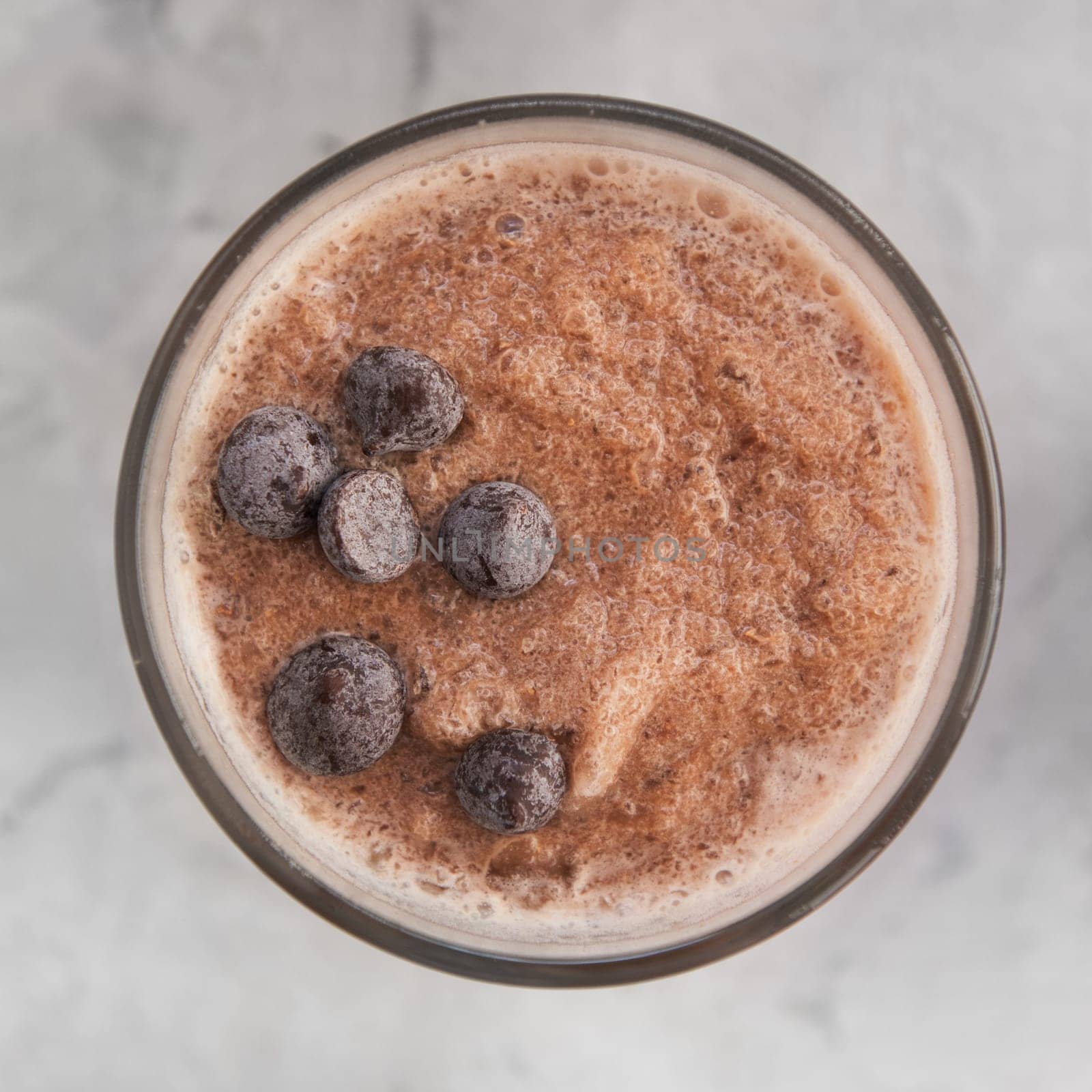 Chocolate smoothie on a white concrete background. Square cropping