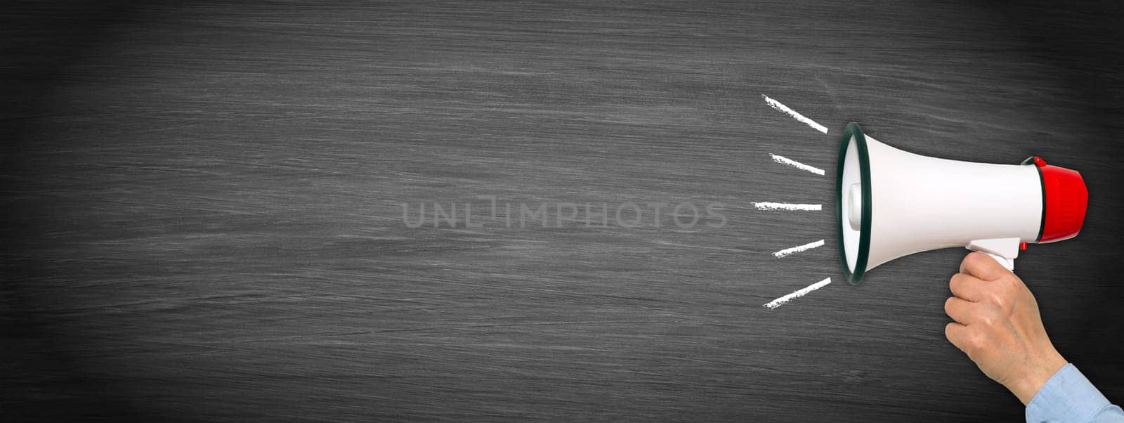 Female hand with megaphone on empty chalkboard - copy space for individual text