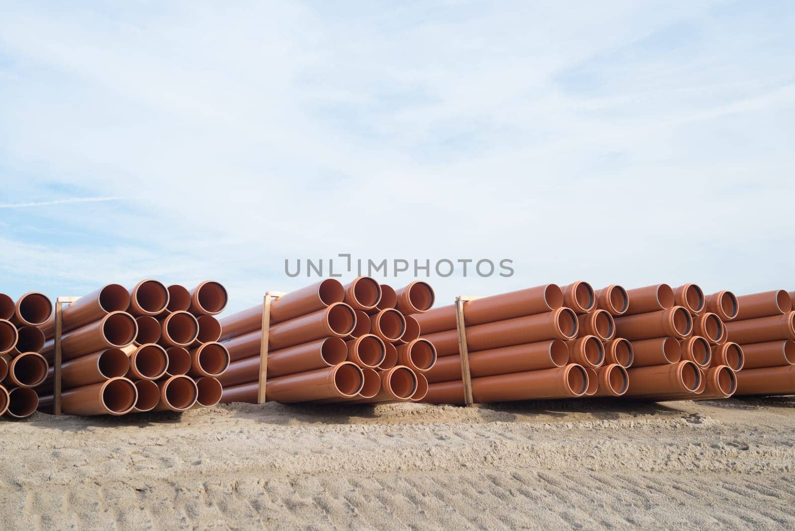 stack of pvc pipes on a construction site