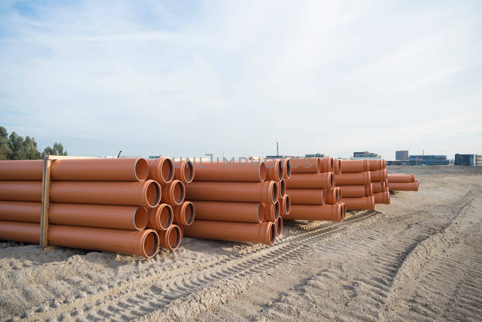 stack of pvc pipes on a construction site