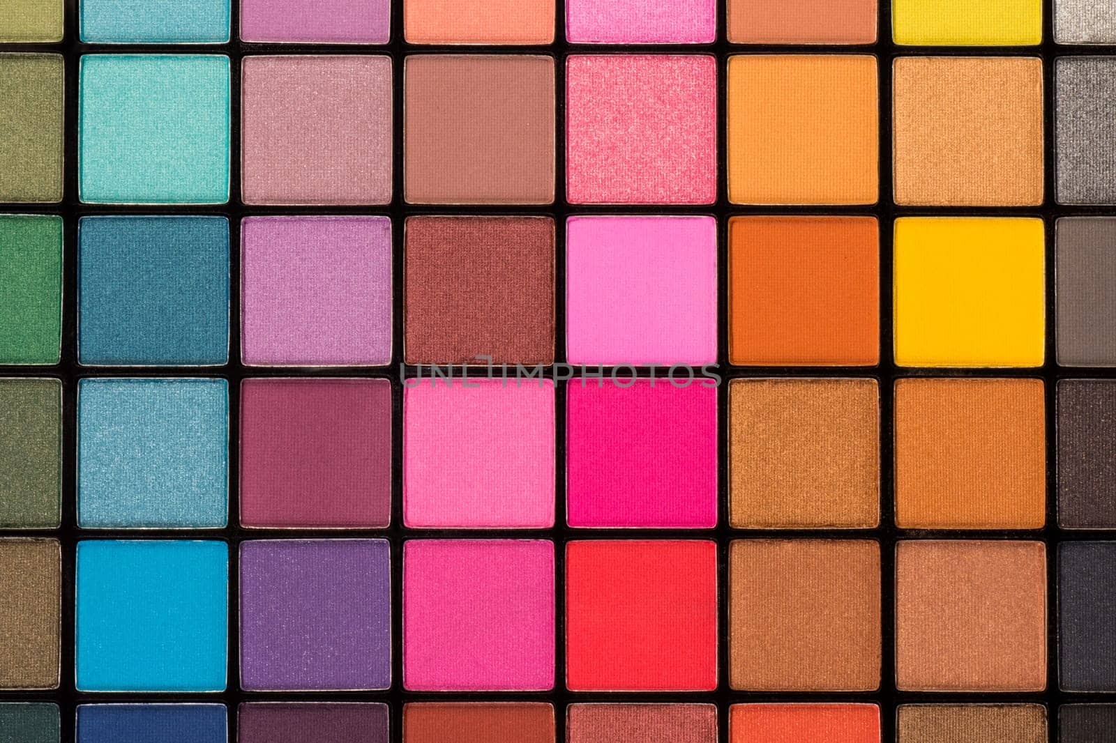 Colorful eye shadow palette with a lot of different colors.