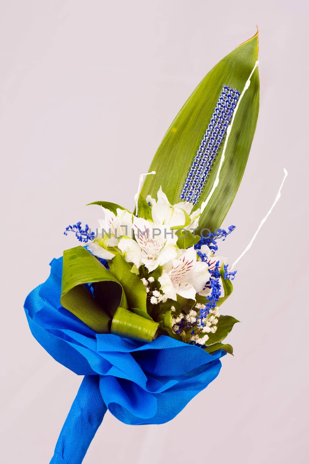 Beautiful bouquet with white flowers on gray background.