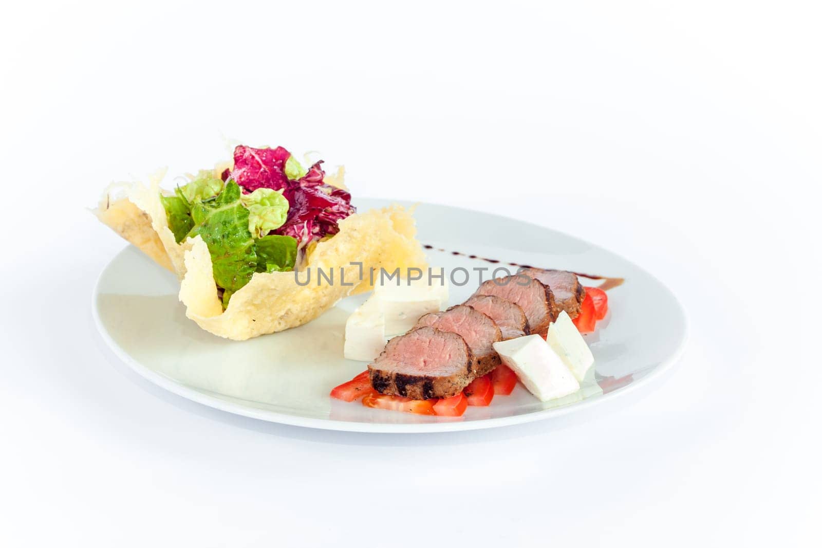 The rack of saucy barbecue pork served on white plate in restaurant