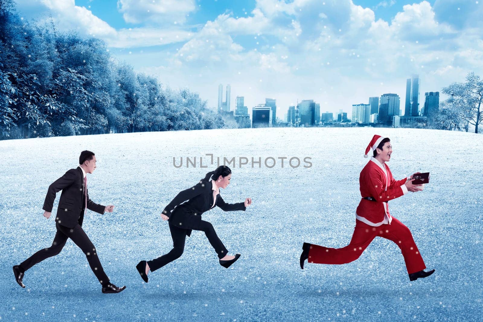 Business people chasing santa claus. Christmas bonus concept