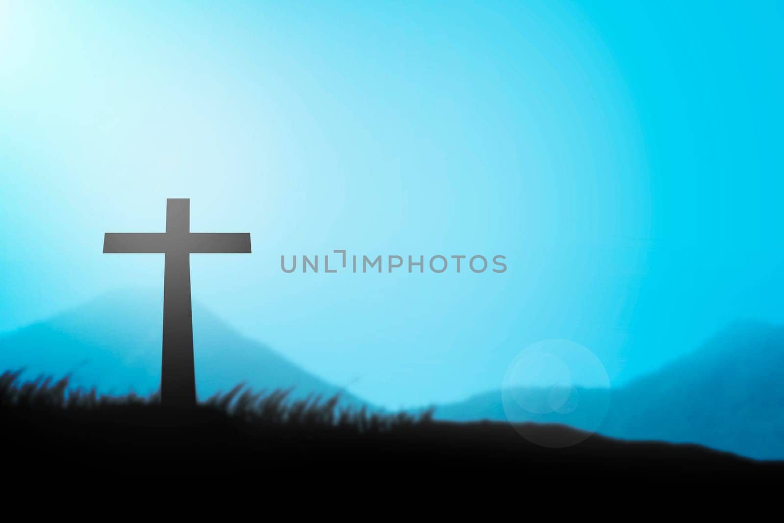 Christian cross with blue sky and haze