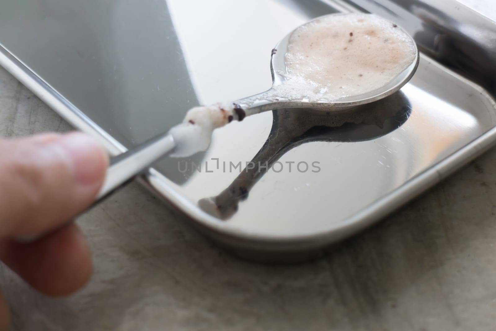 Shiny milk chocolate stain spoon, stock photo