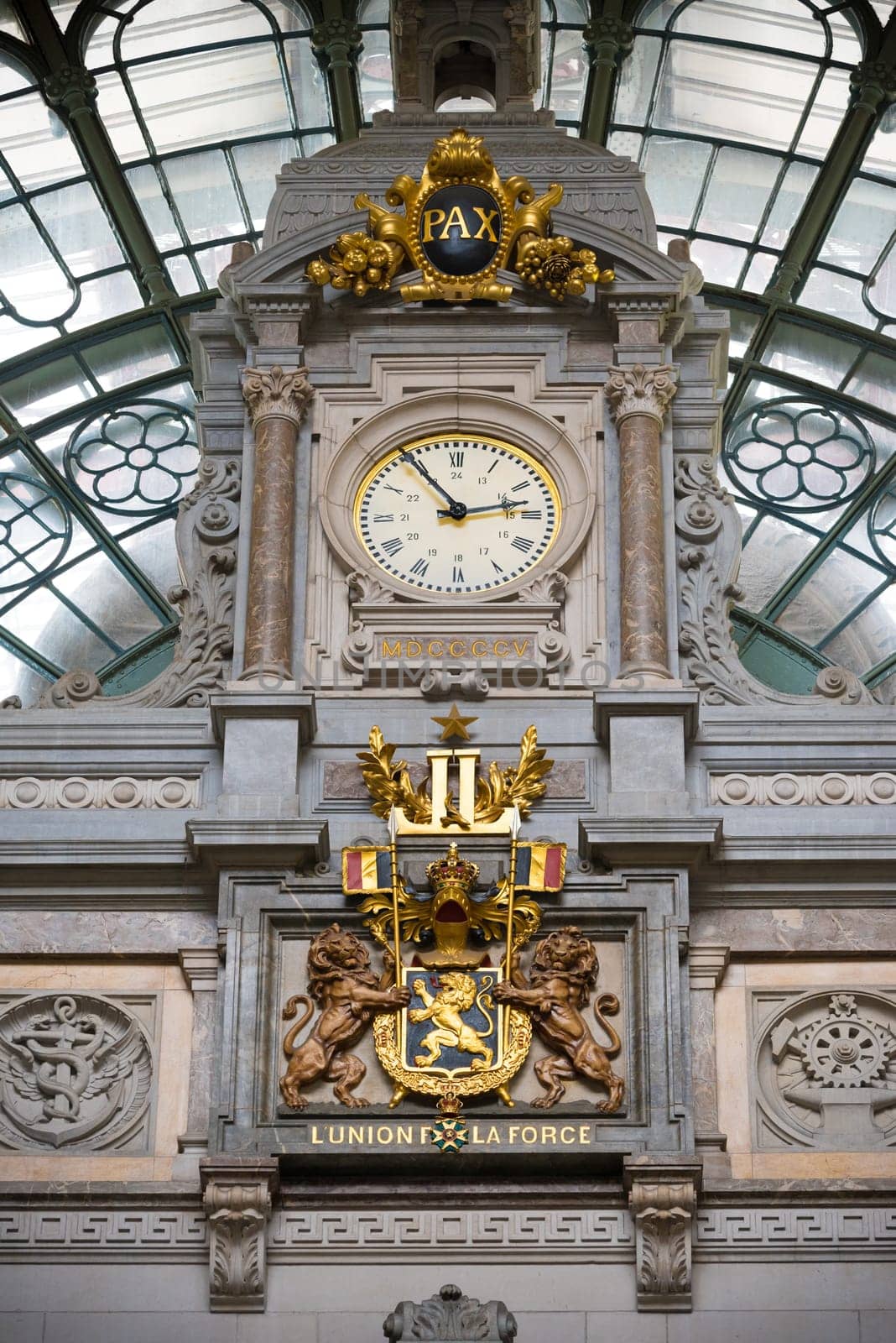 ANTWERP, BELGIUM - OCTOBER 2, 2016: Baroque interior of the central station with a gold decorated clock