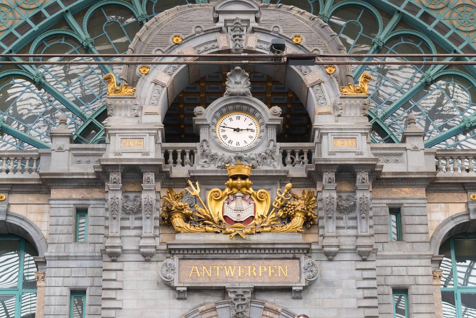 ANTWERP, BELGIUM - OCTOBER 2, 2016: Baroque interior of the central station with a gold decorated clock
