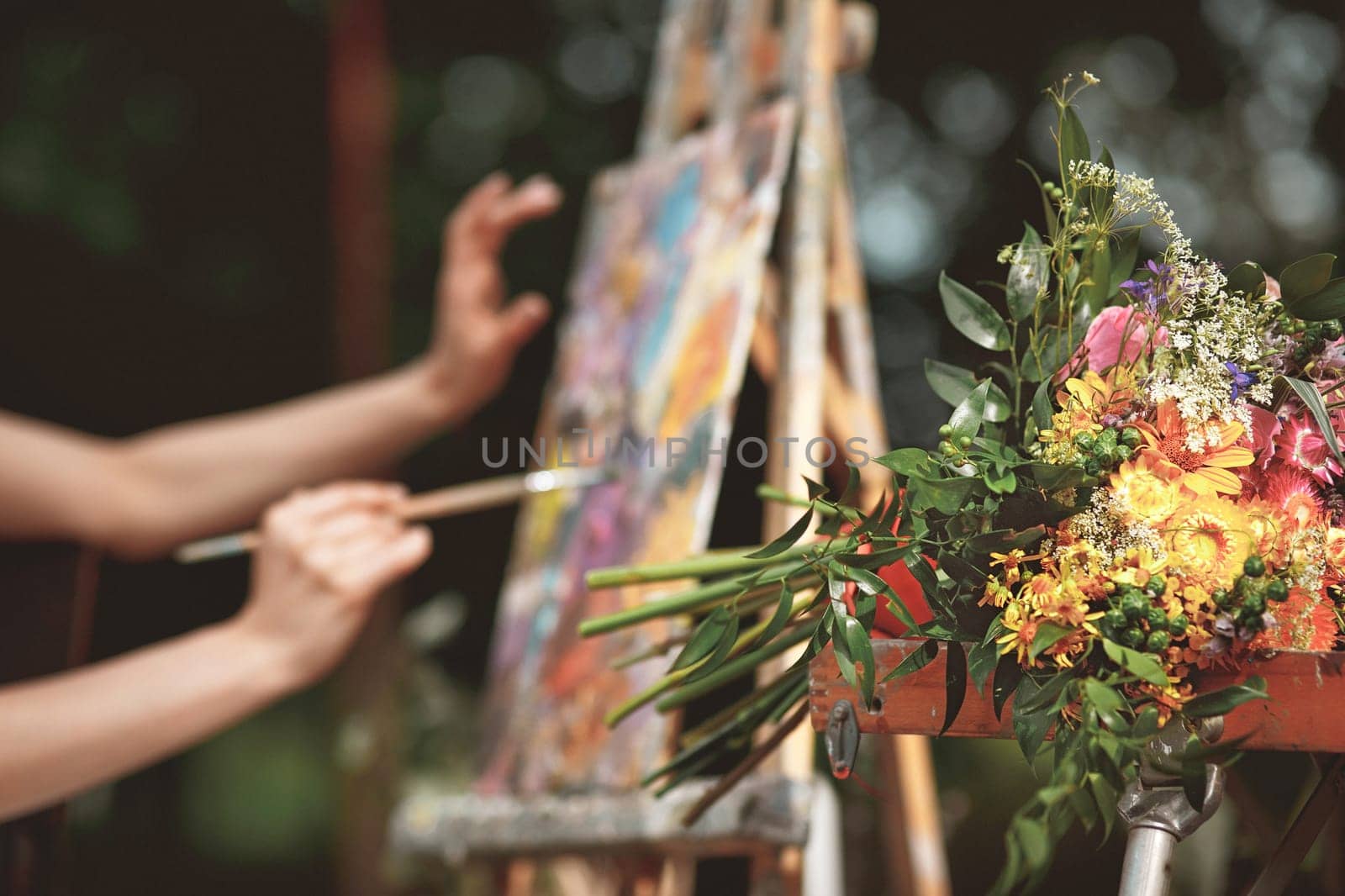 The artist's hand close-up on the background of the picture