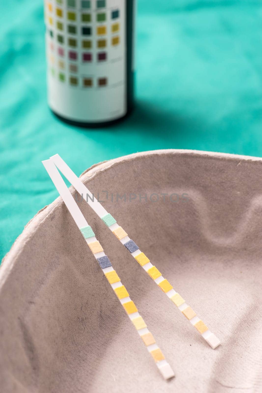 Medical Stethoscope lying on the hospital's green background. The background can be a textile part of a doctor or nurse's work uniform