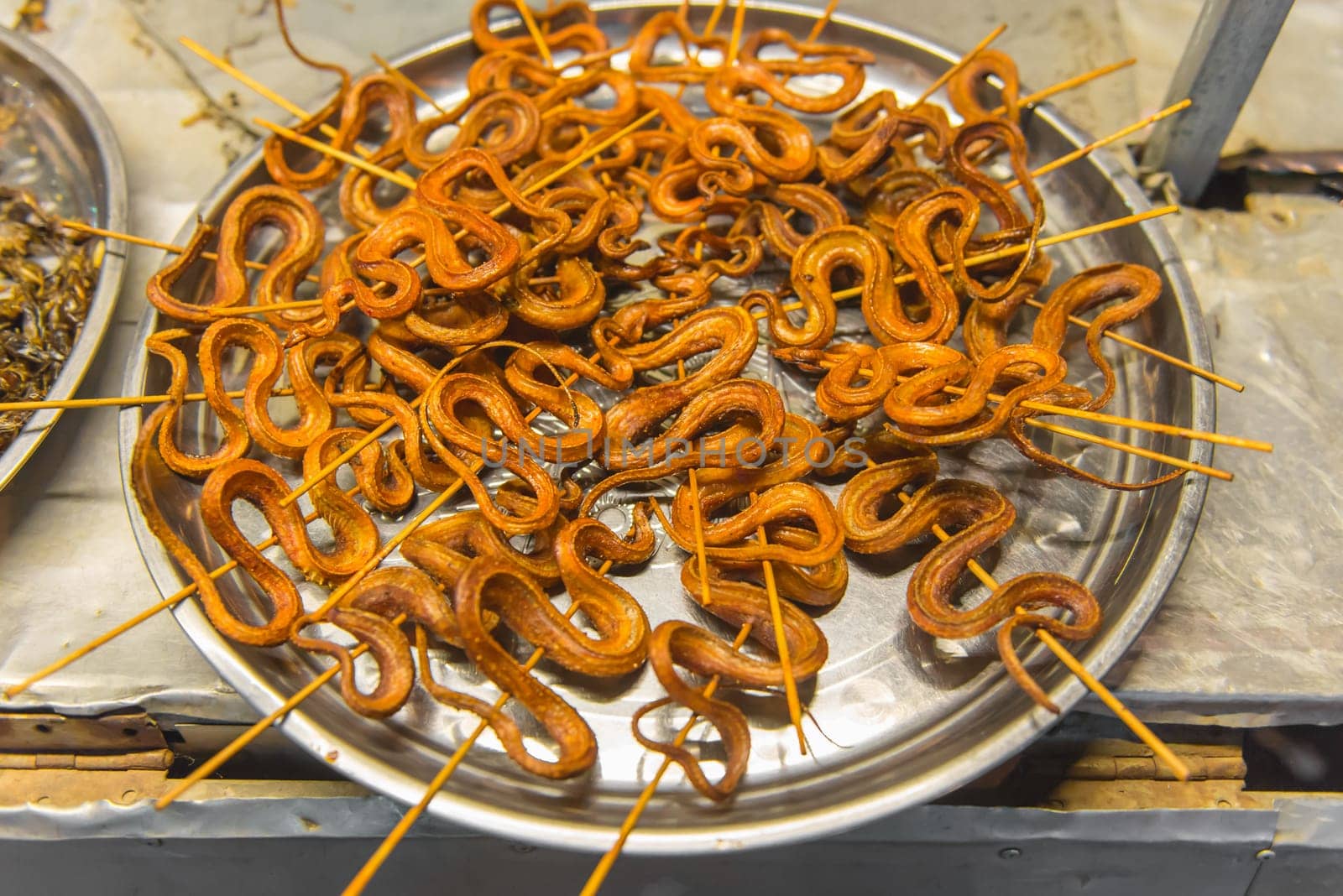 grilled snakes on sale for food market in China.