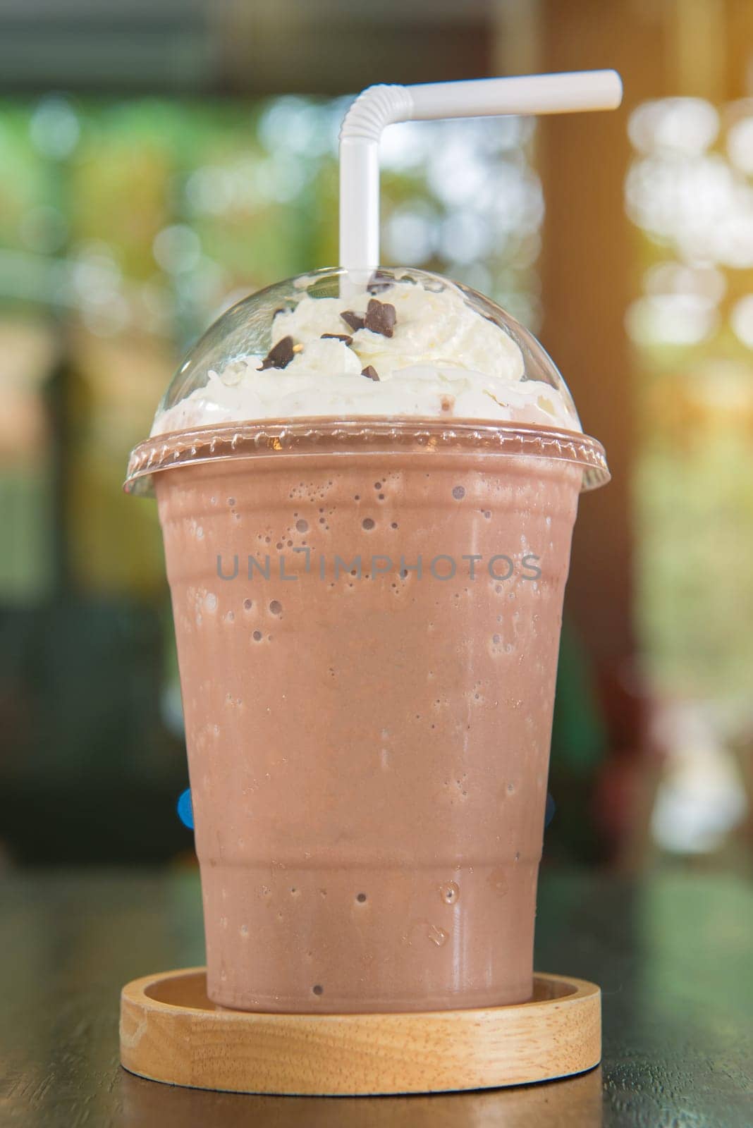 Chocolate smoothie or Chocolate frappe and whipping cream topping in cafe.