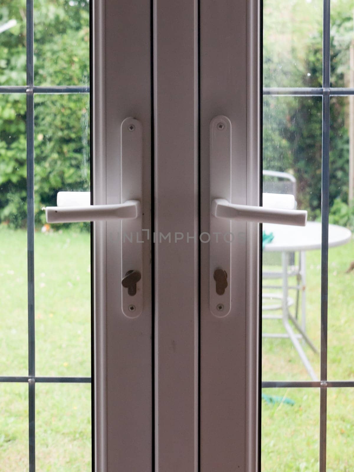 two locked backdoor handles up close garden  England  UK