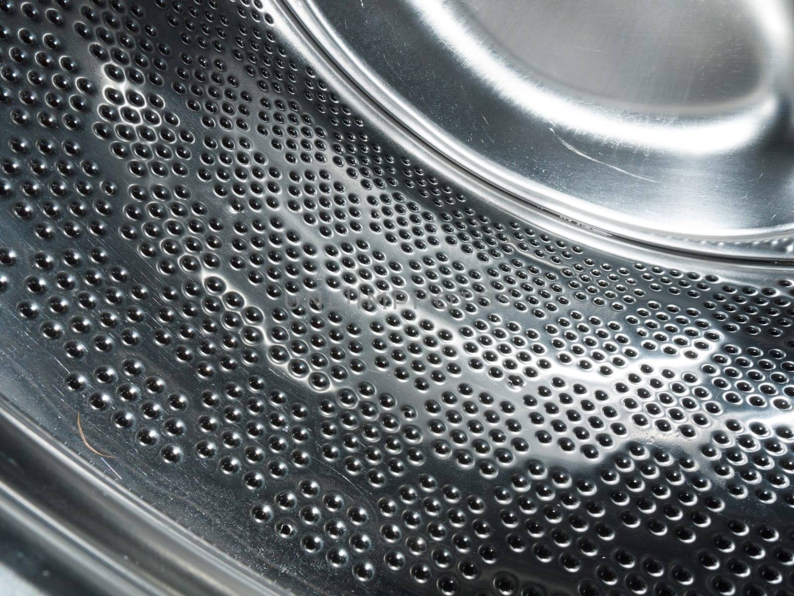 close up of metal inside a washing machine  England  UK