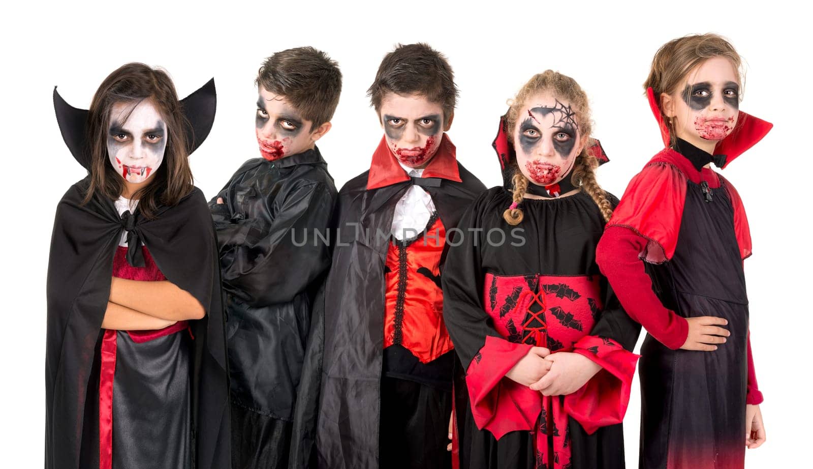 Group of kids with face-paint and Halloween vampire costumes