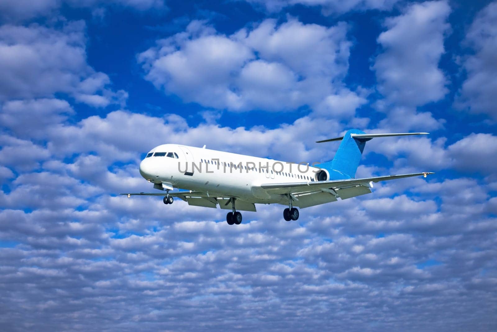 Aircraft on landing,passenger aircraft with source clouds