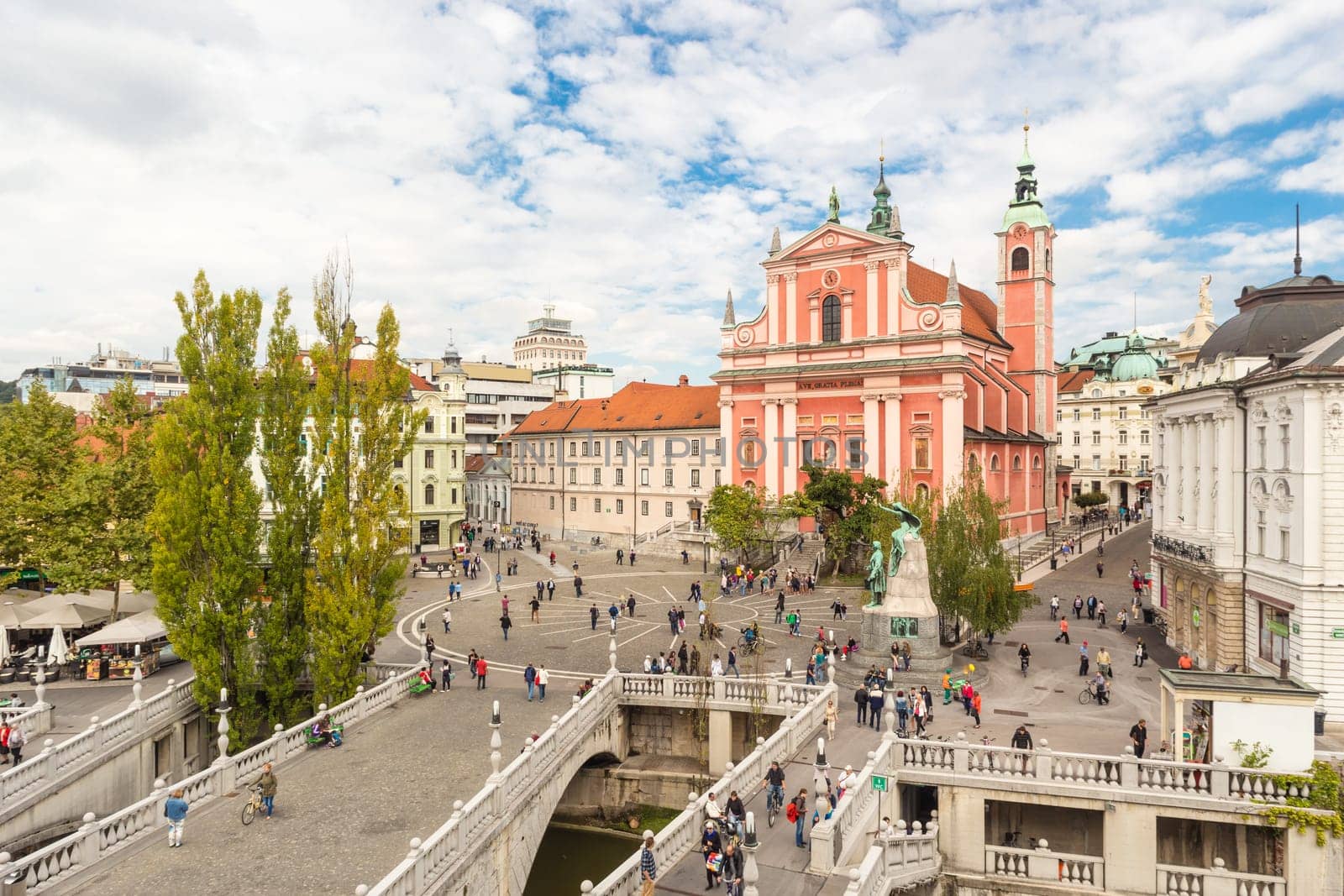 Romantic Ljubljana's city center: river Ljubljanica, Triple Bridge, Tromostovje, Preseren square and Franciscan Church of the Annunciation. Ljubljana, Slovenia, Europe.