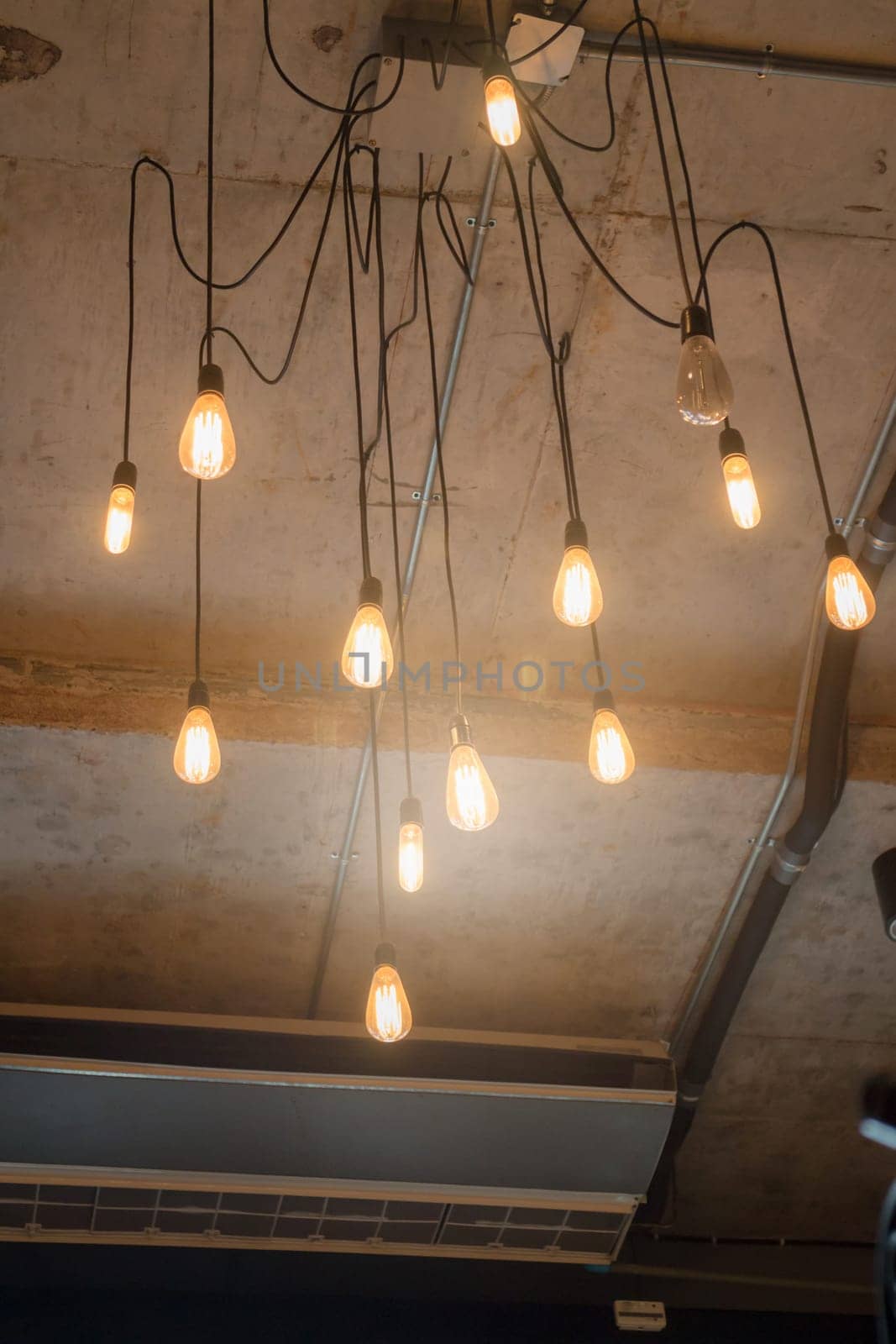 Antique light bulbs hanging on the ceiling, stock photo