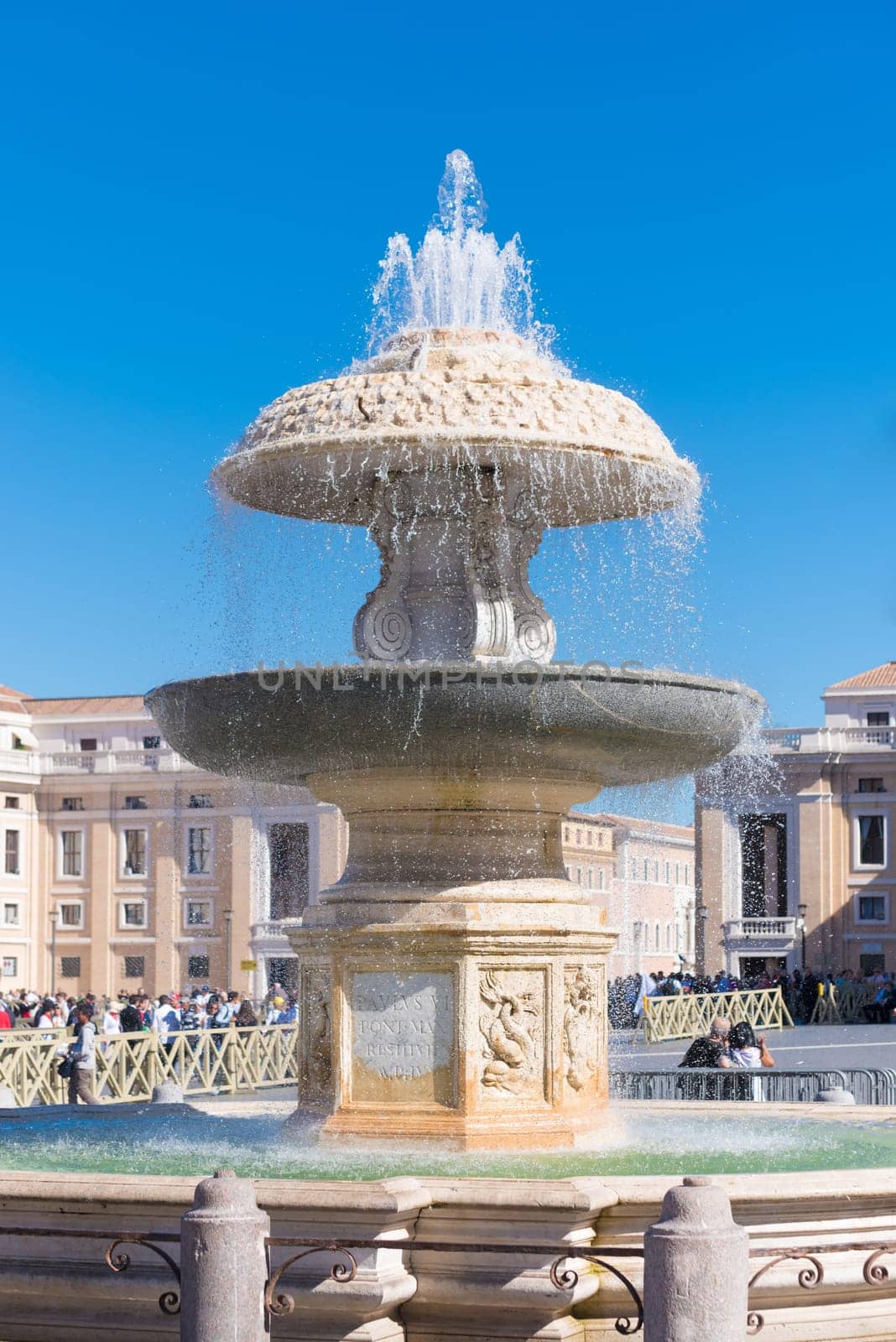 fountain at the famous st peter's square in vatican city