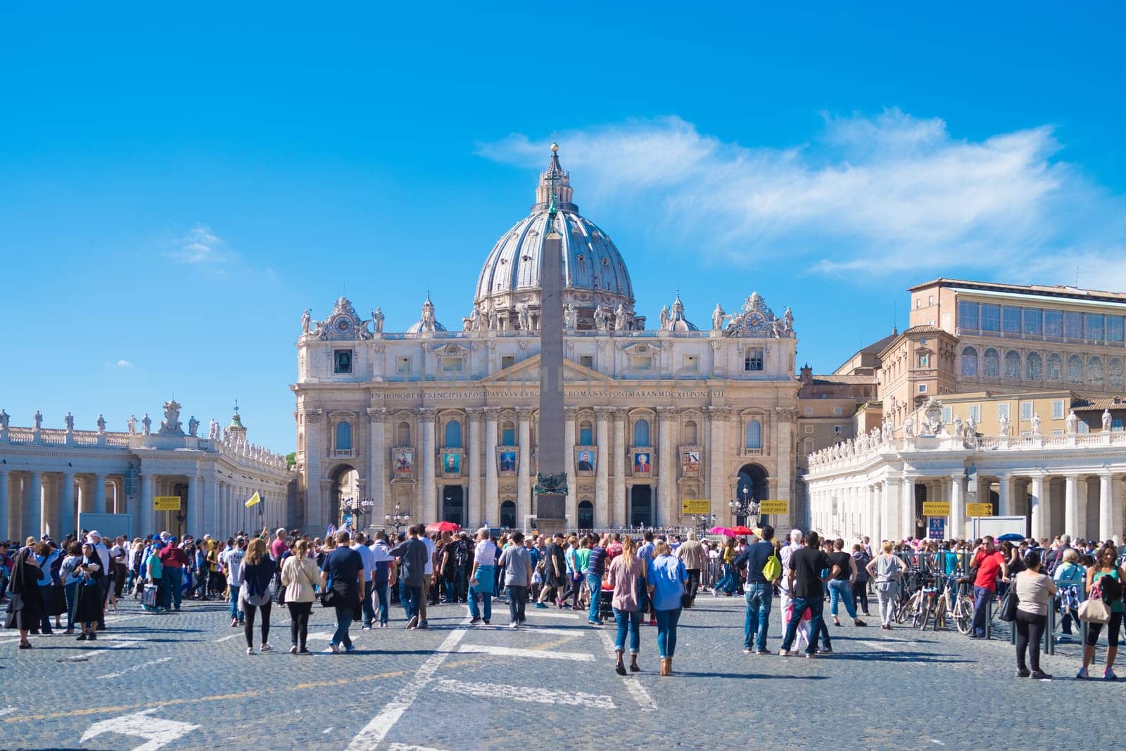 VATICAN CITY, VATICAN - OCTOBER 16, 2016: tourists at the famous saint peter's square in front of the Basilica di san pietro