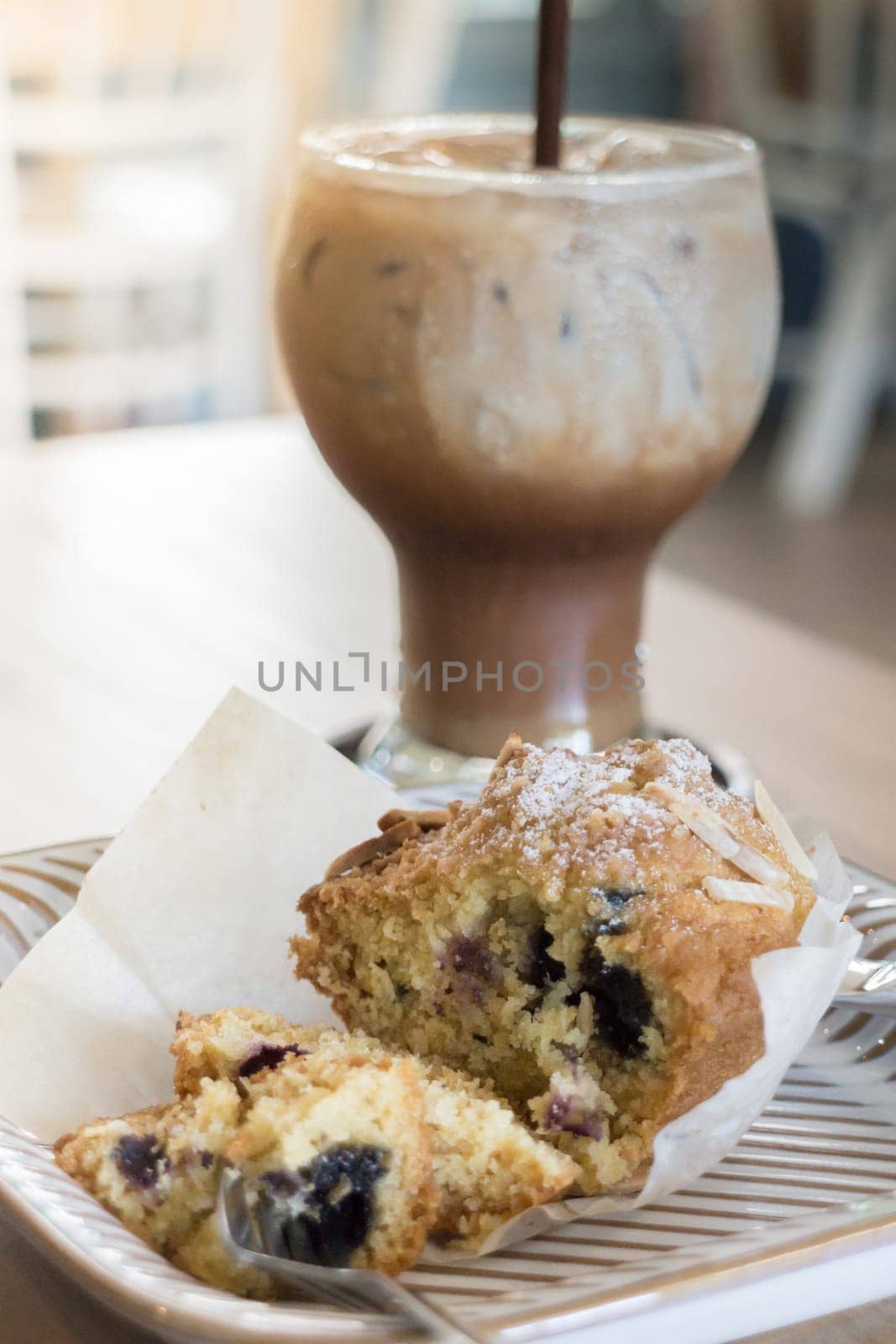 Blueberry muffin and iced coffee mocha, stock photo