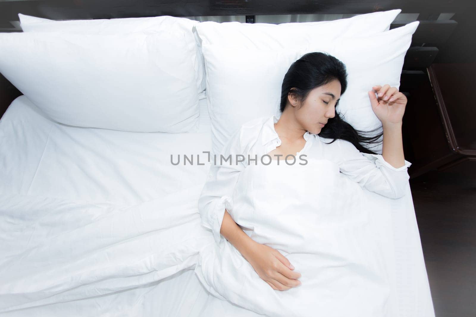 Happy young beauty women sleeping and smile on bed in the morning