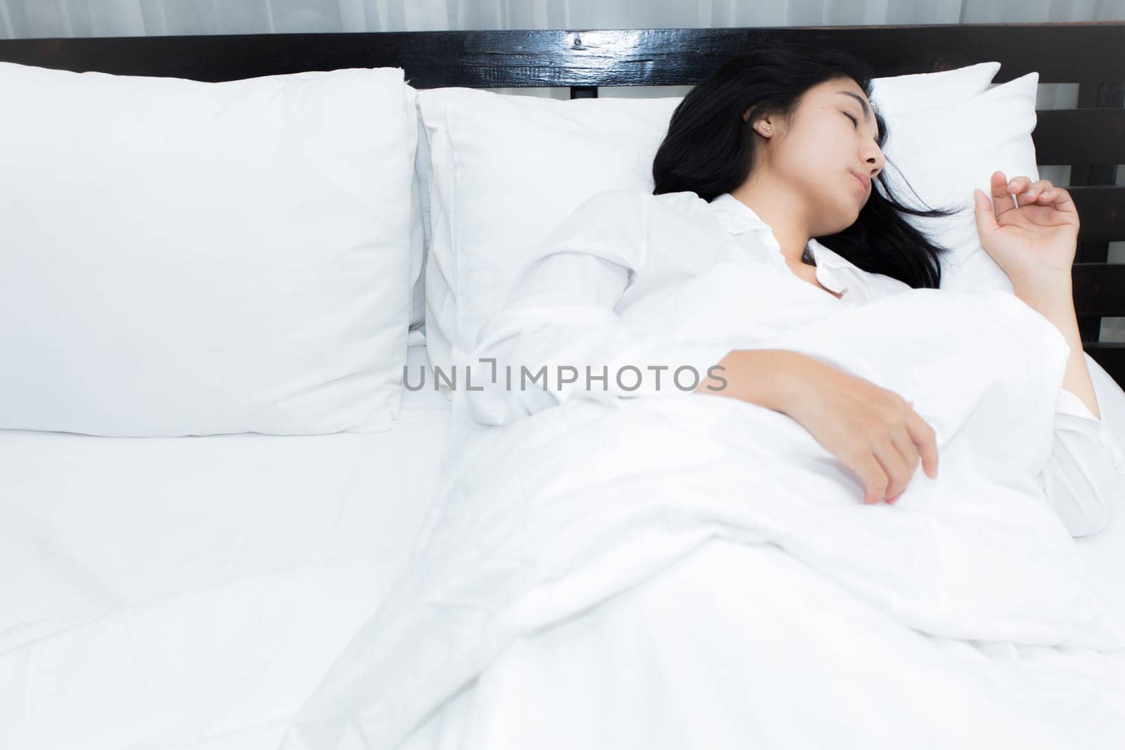 Happy young beauty women sleeping and smile on bed in the morning