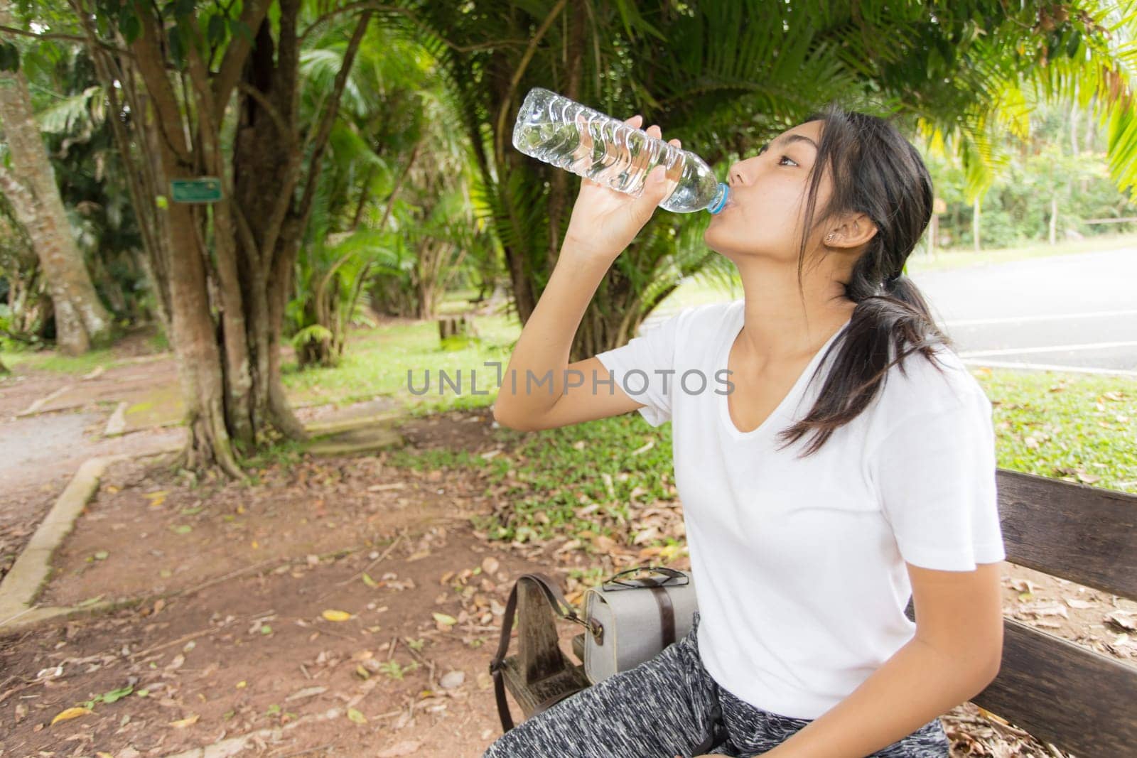 Beautiful smiling young asian woman enjoying yoga, relaxing, feeling alive, breathing fresh air, got freedom from work