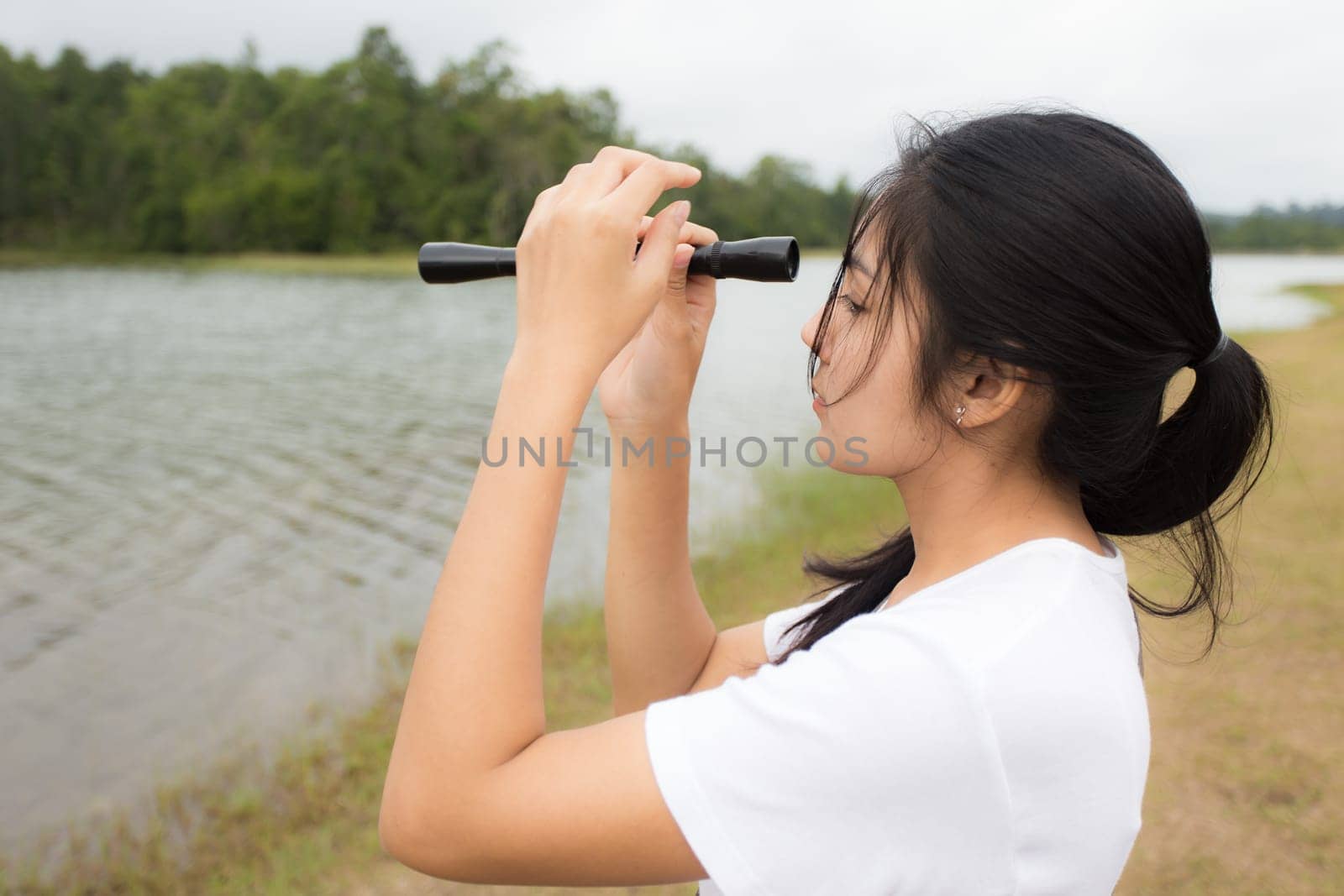 Beautiful smiling young asian woman enjoying yoga, relaxing, feeling alive, breathing fresh air, got freedom from work