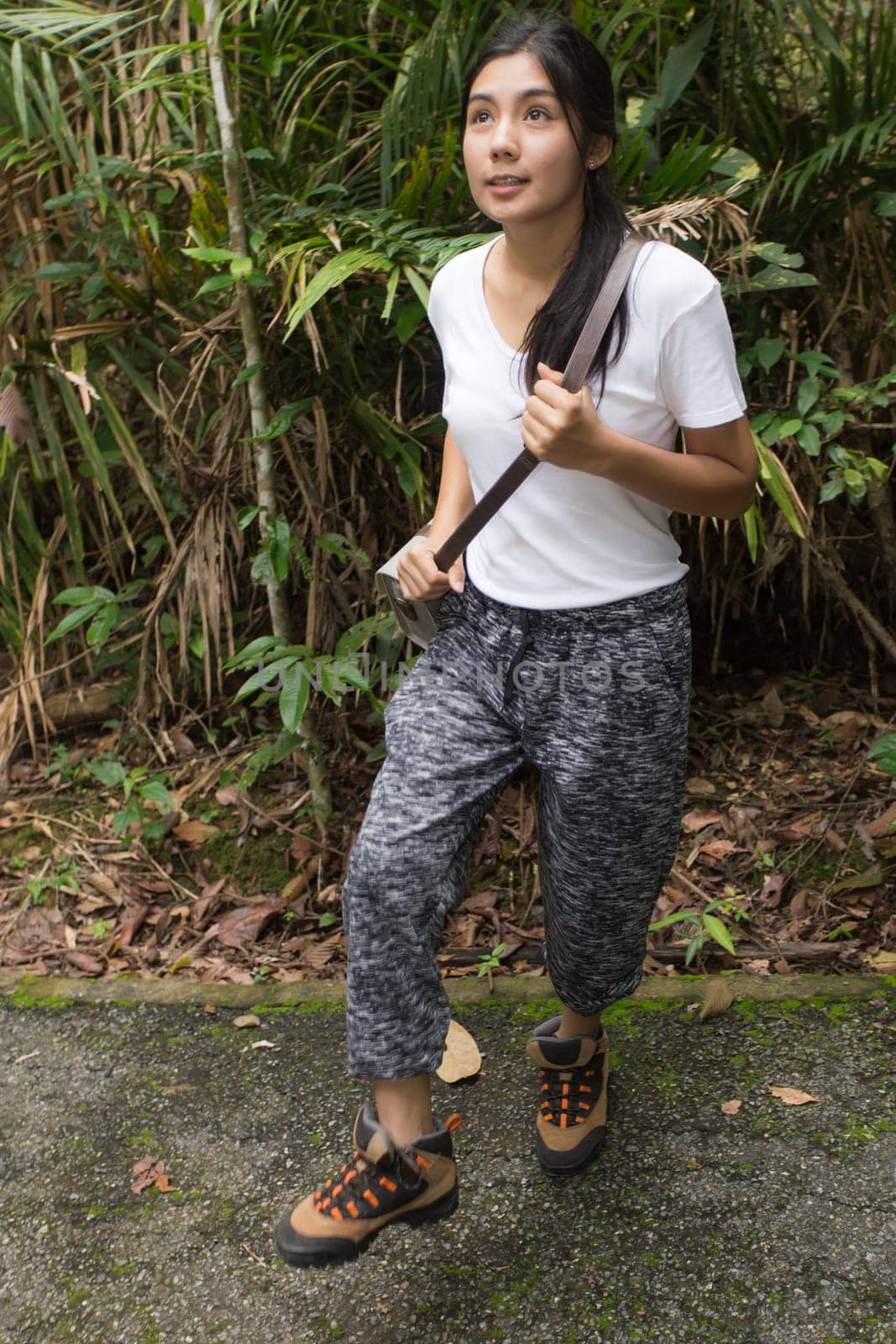Beautiful smiling young asian woman enjoying yoga, relaxing, feeling alive, breathing fresh air, got freedom from work