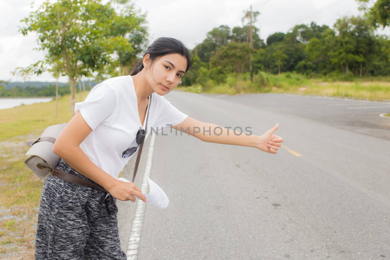 Woman opened the hood Broken car on the side See engines that are damaged or not