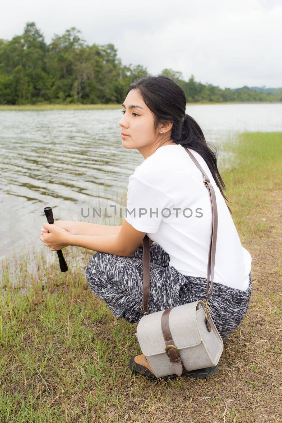 Beautiful smiling young asian woman enjoying yoga, relaxing, feeling alive, breathing fresh air, got freedom from work