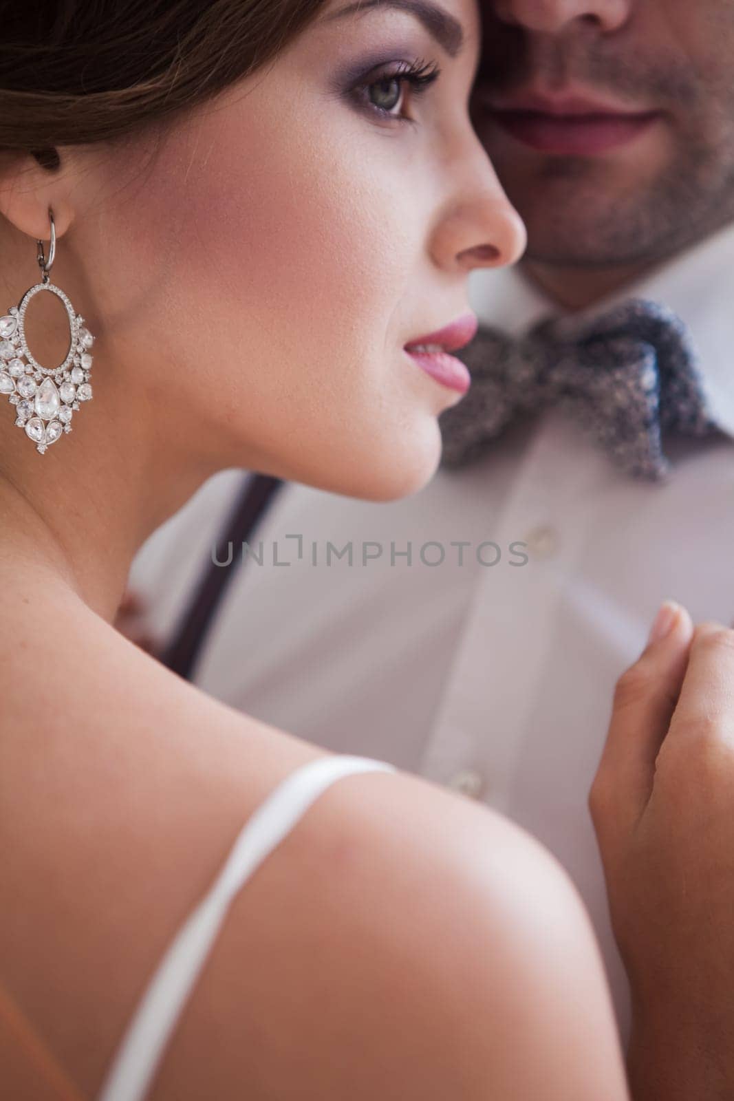 The beautiful bride in wedding dress, white background