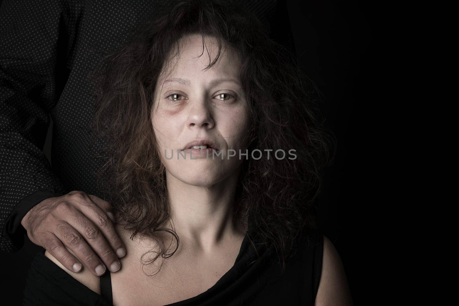 Abused woman with husband, victim of domestic violence