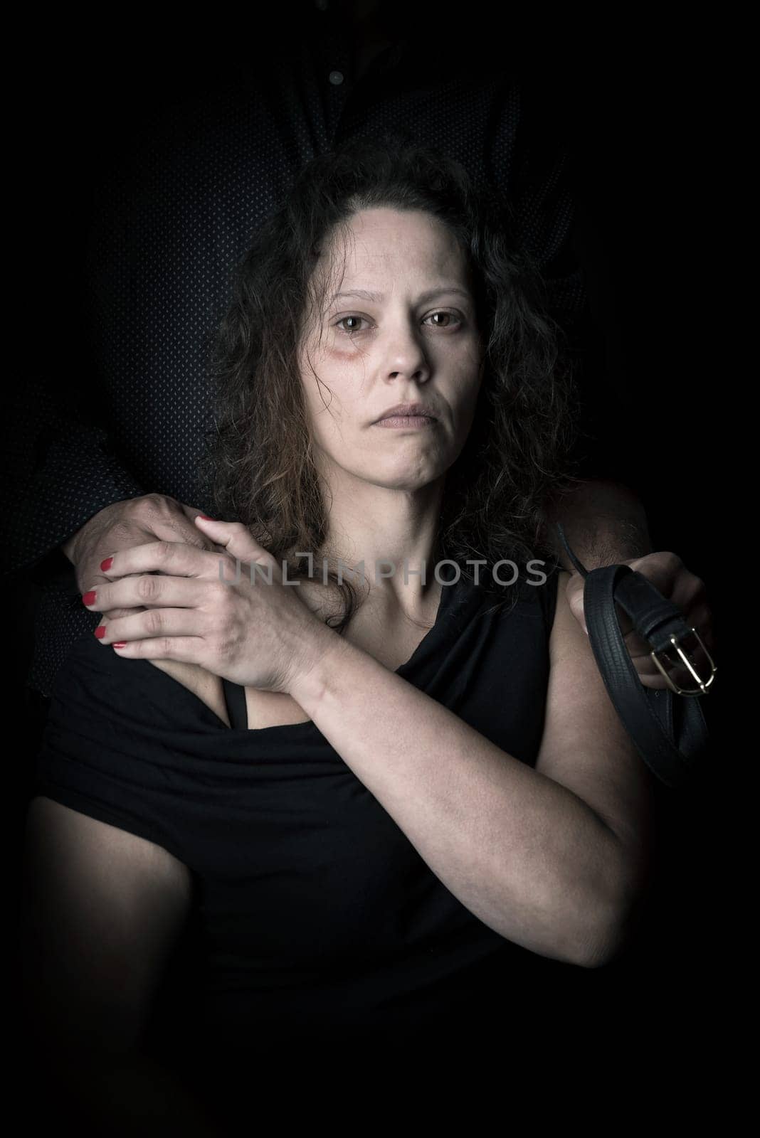 Abused woman with husband, victim of domestic violence
