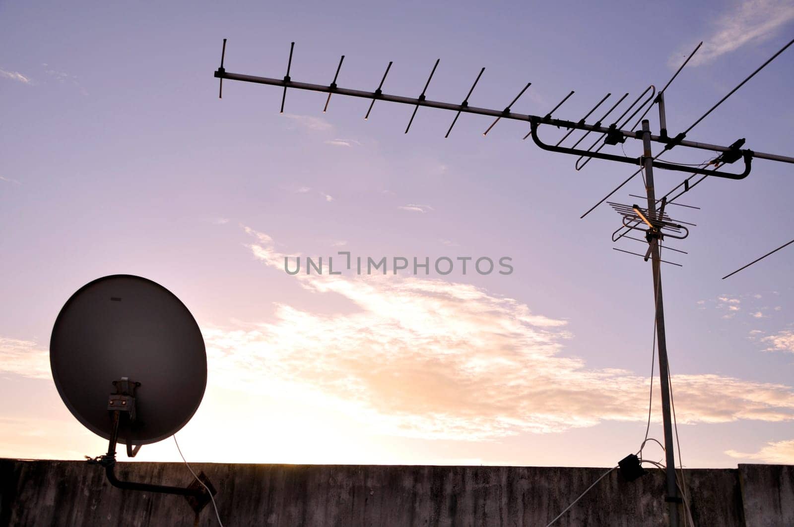 TV aerial and satellite dish fixed to the roof